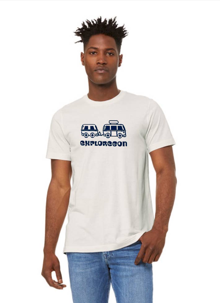 Model wearing white t-shirt with navy blue exploregon van with trailer image