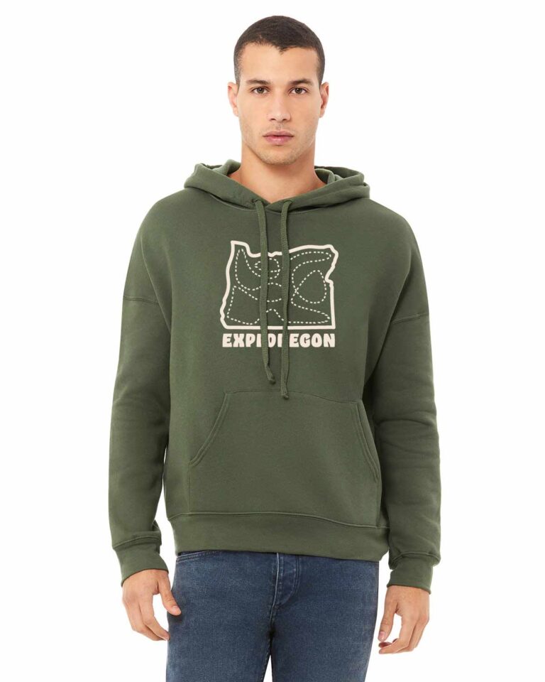 Olive drab hooded sweatshirt with outline of the state of Oregon and dashed lines in a haphazard path with in the state. Exploregon