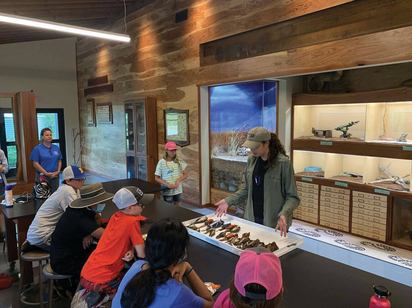 Right side of the Margaret Bamberger Research Center with students and educator